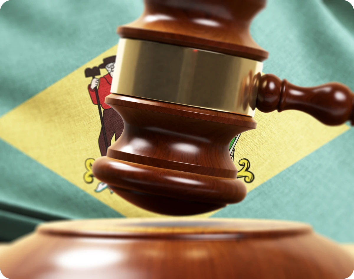 Gavel in front of Wisconsin state flag.